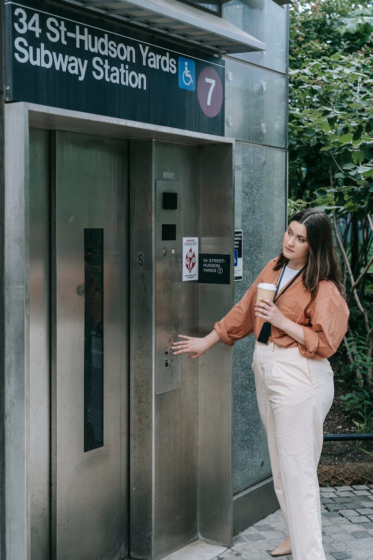 Woman Waiting For Subway Station Elevator