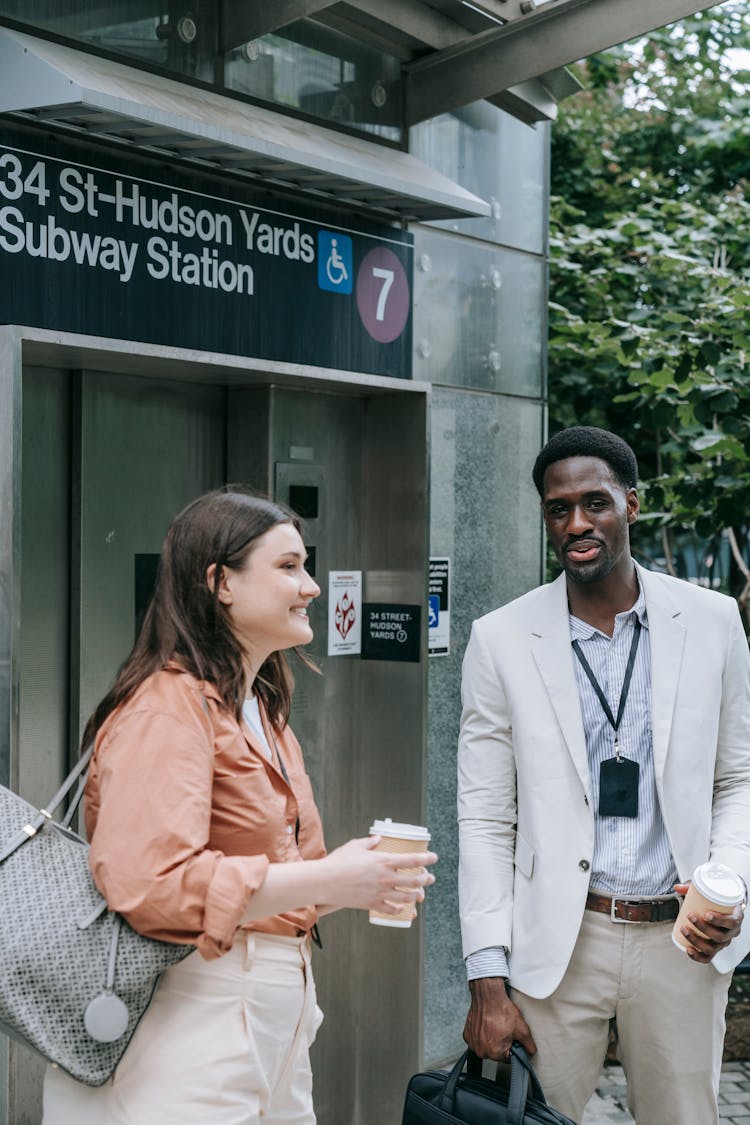 Man And Woman In Front Of Subway Station Elevator