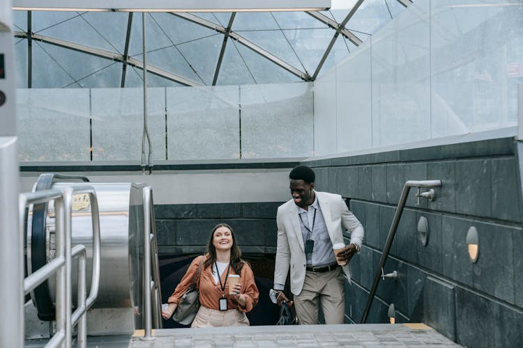 Man And Woman On Subway Entrance Steps