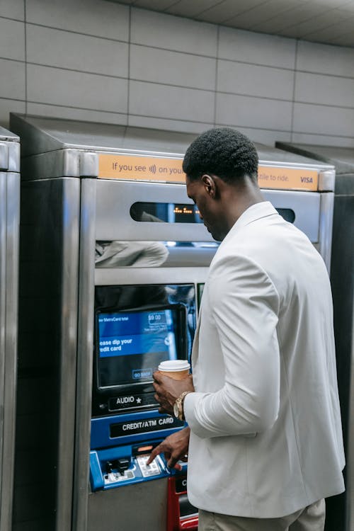 Man using an Automated Teller Machine