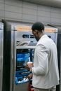 Man using an Automated Teller Machine