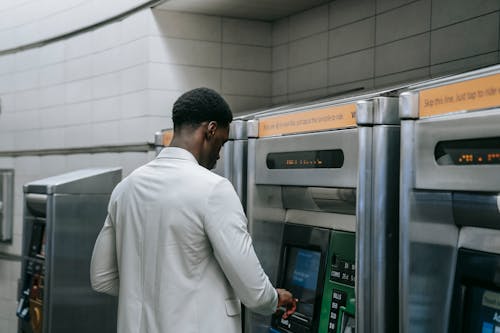 Man using Automated Teller Machine