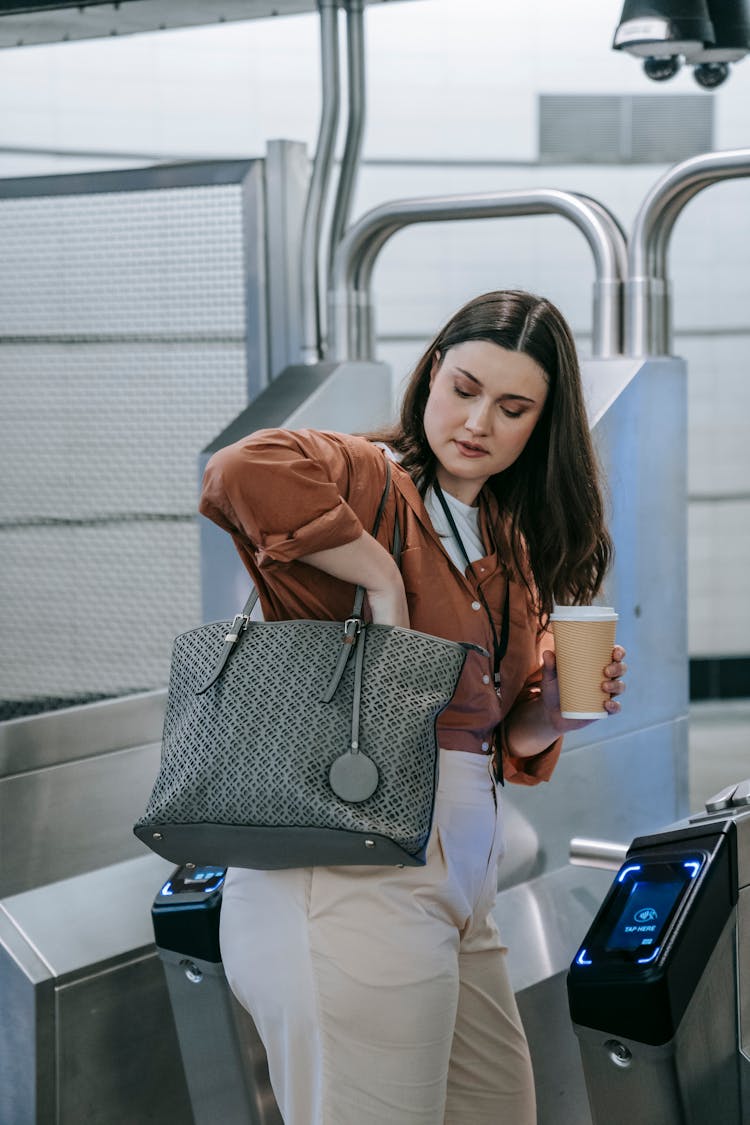 Woman By Metro Entrance Gates