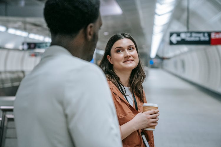 Man And Woman Waiting At Subway Station