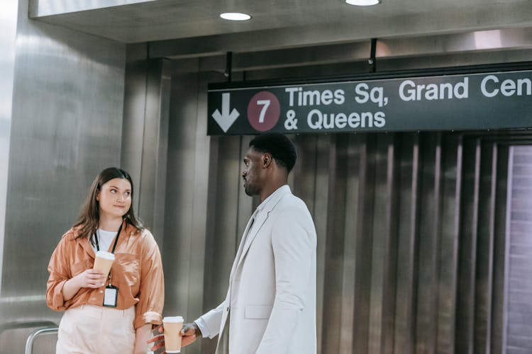 Man And Woman Talking On A Subway Station 