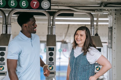 Man and Woman at Subway Station Gates