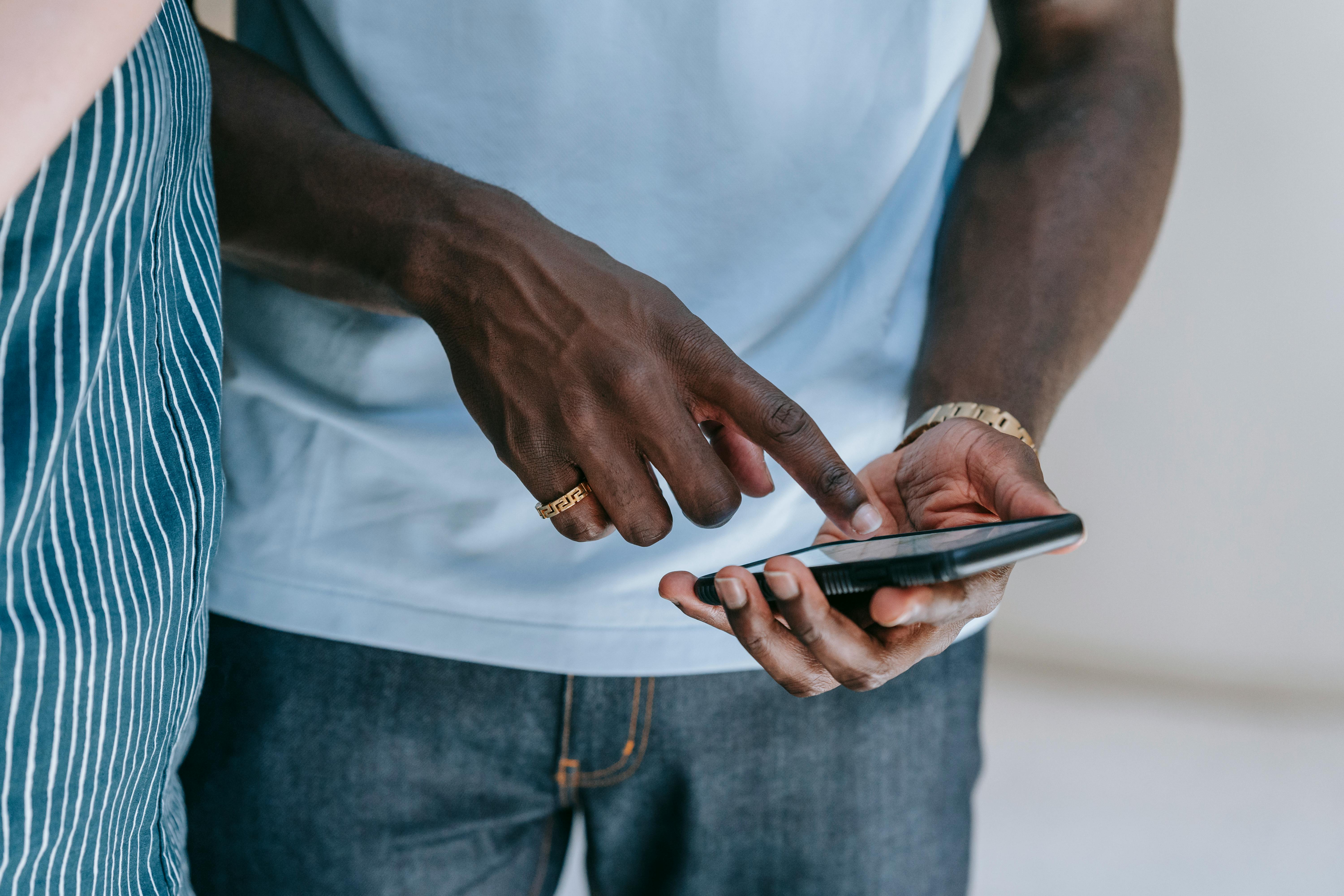 Close Up Photo of a Person Holding Cellphone