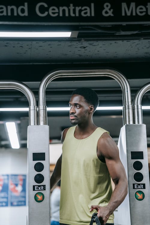 Young Muscular Man Exiting a Subway Gate