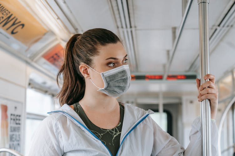 Woman Wearing Face Mask In Bus