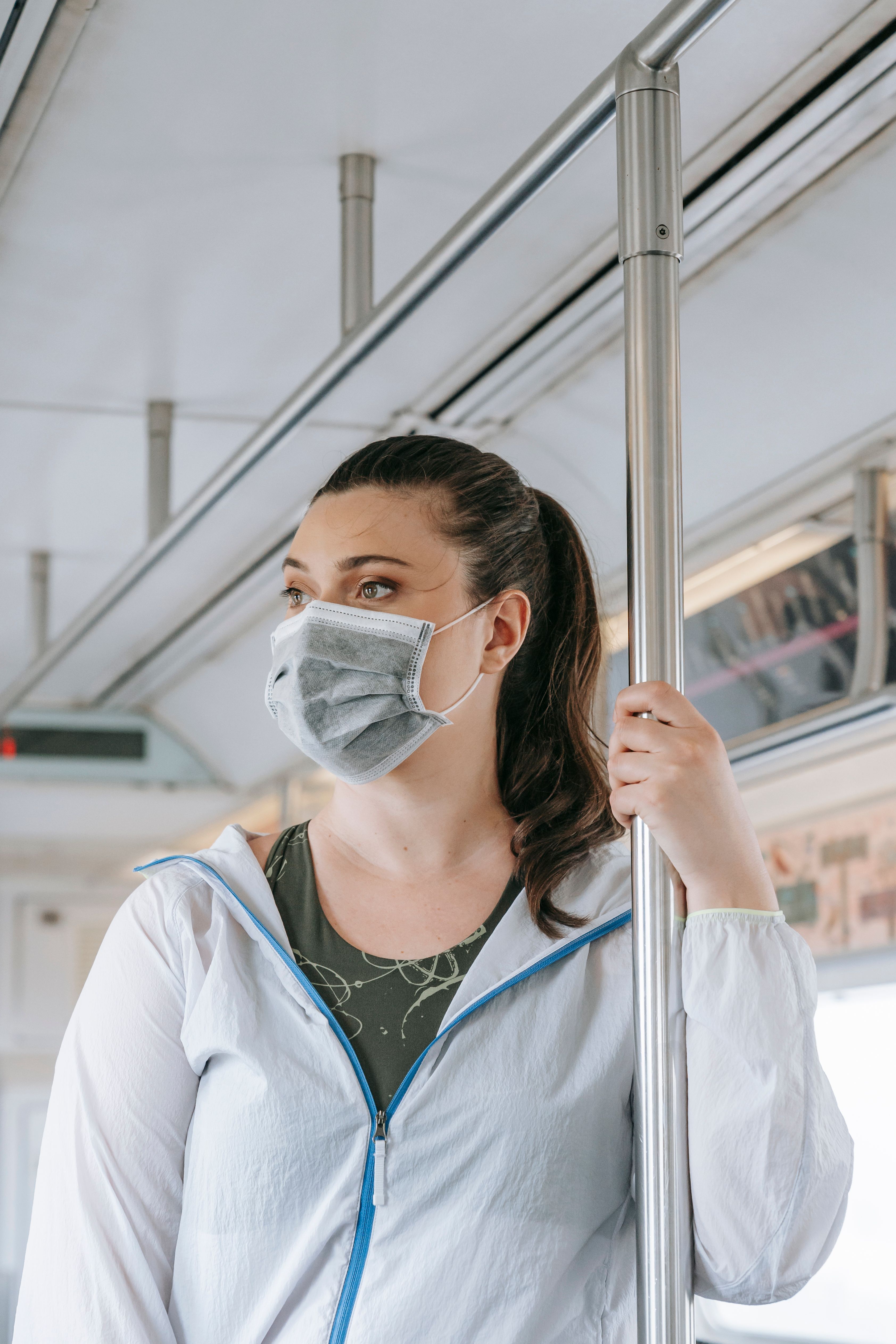 A Woman Wearing Face Mask and Jacket · Free Stock Photo