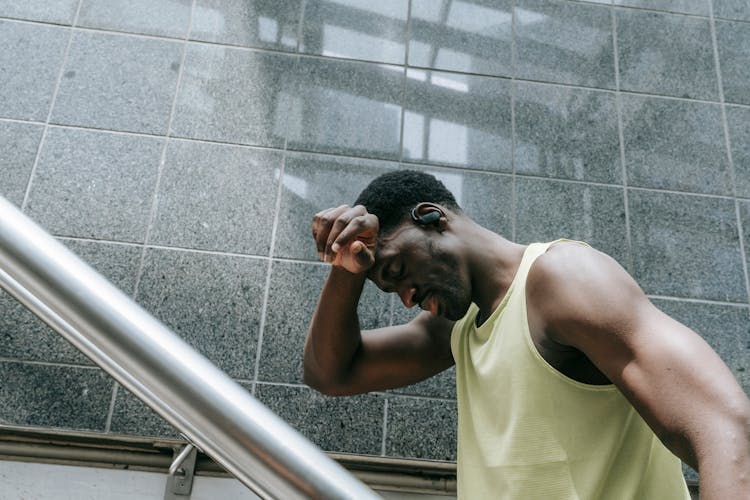 A Man Sweeping His Sweat