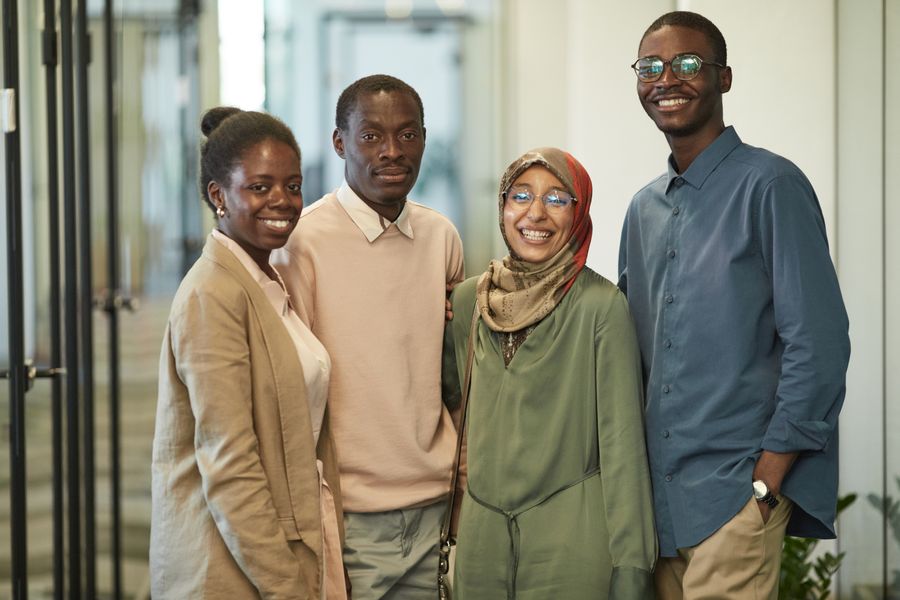 Young African people smiling in a professional community setting