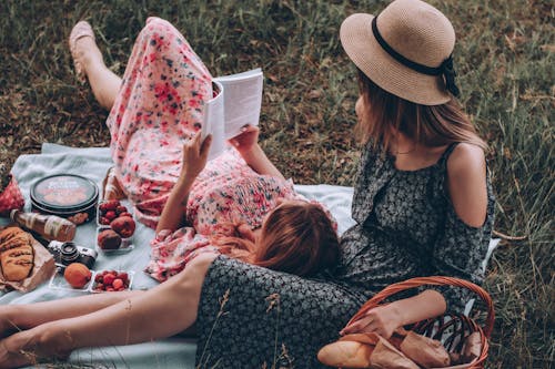 Women Reading Book Together