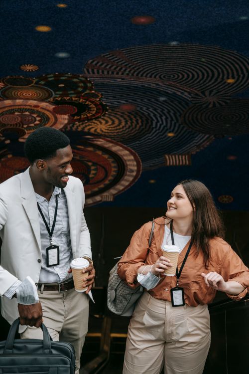 A Man and Woman Holding a Coffee While Looking at Each Other · Free ...