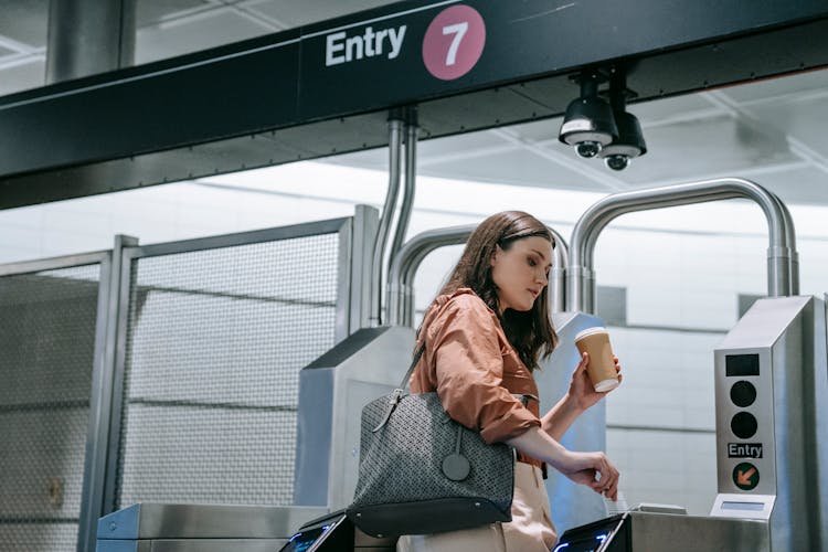 Woman Entering A Train Station