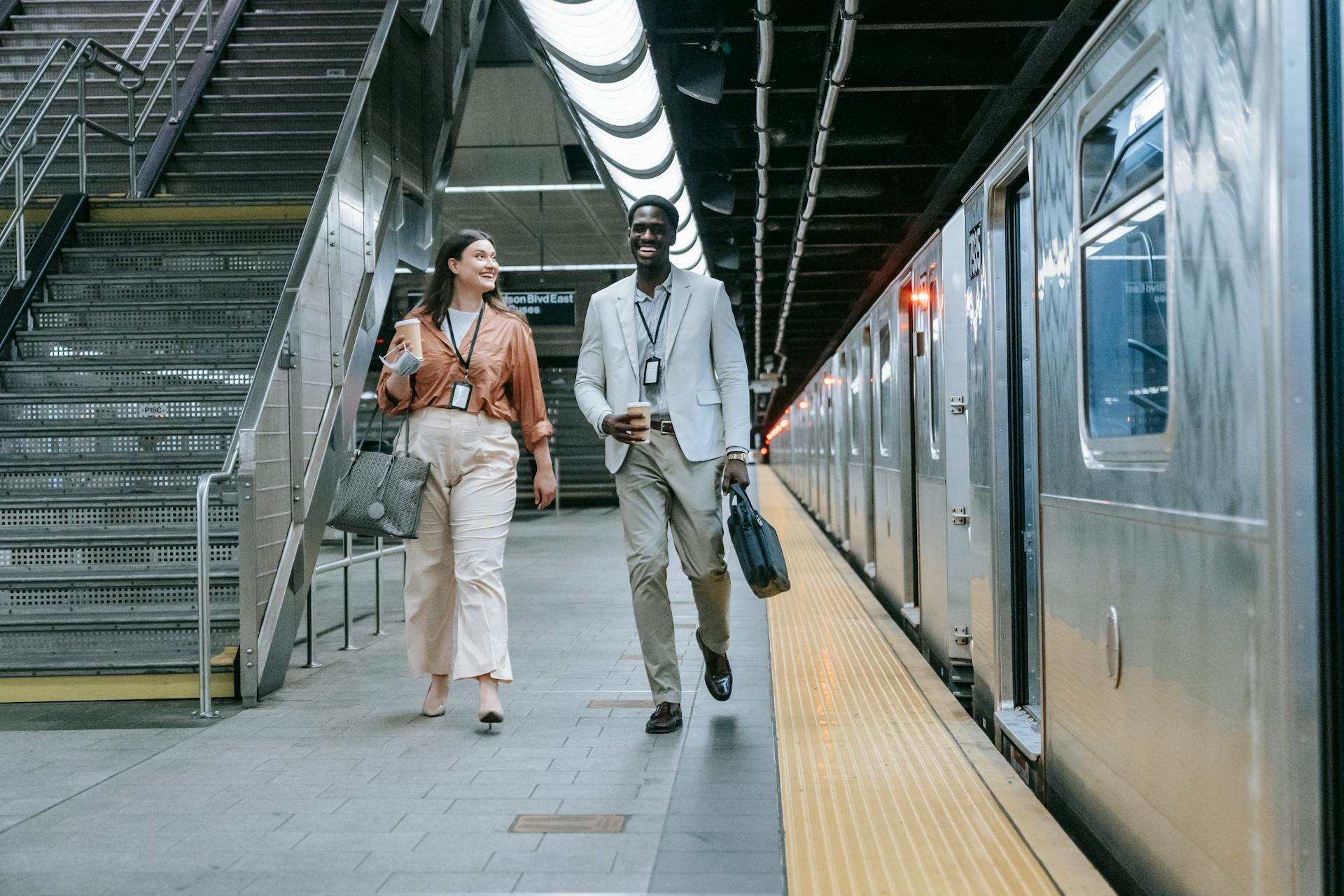 A Man and Woman Walking in the Train Station