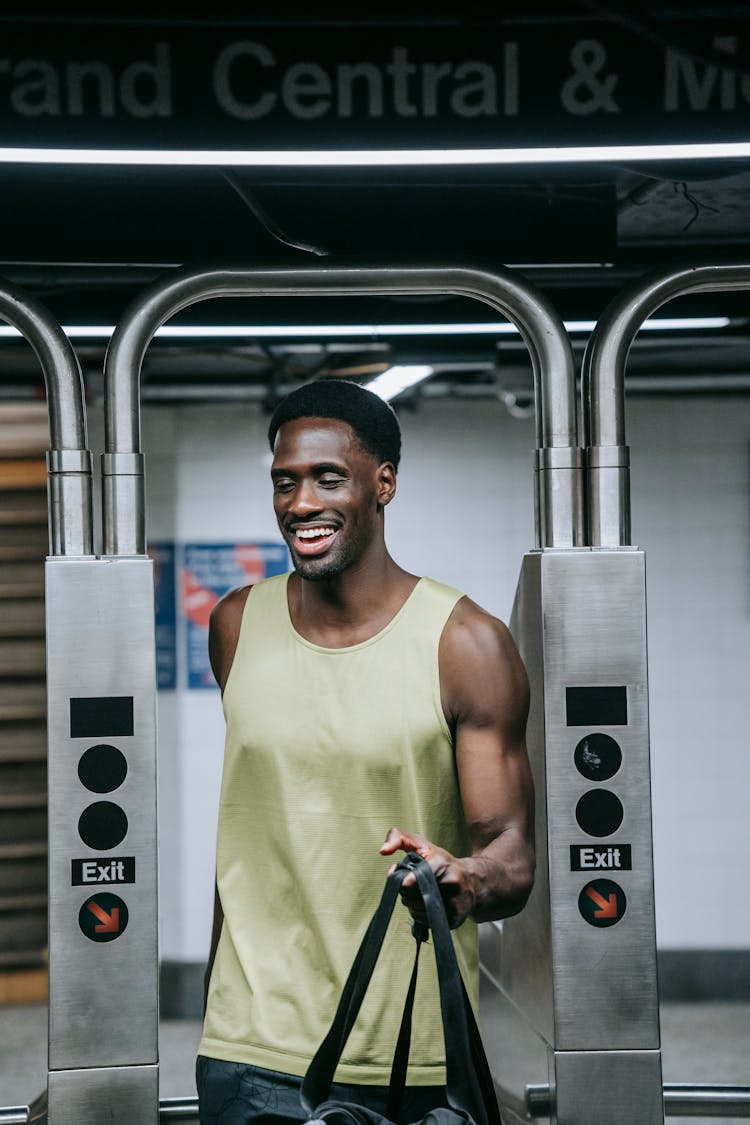 Man In Tank Top In Exit Gates