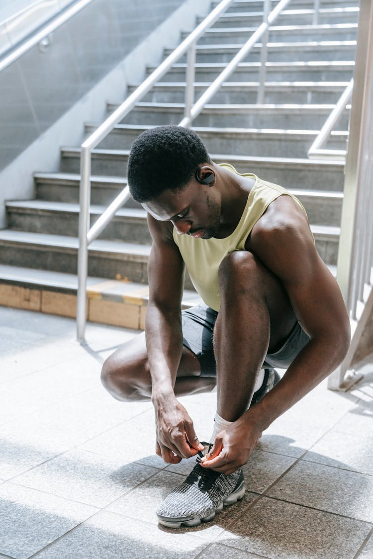 Man Tying His Shoe Lace