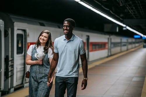 A Couple Smiling While Holding Hands