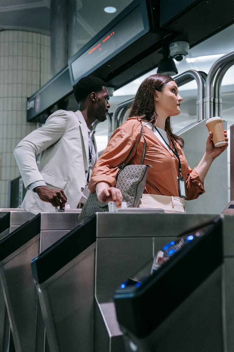 Man And Woman On A Turnstile