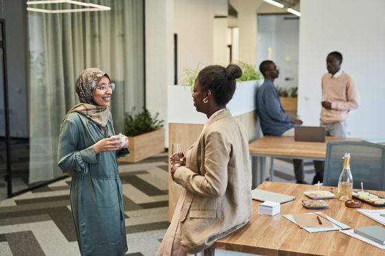 Founders talking at an evening mixer — photo by Edmond Dantes on Pexels