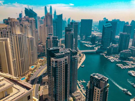 Stunning aerial view of Dubai Marina skyline with modern skyscrapers and canal.