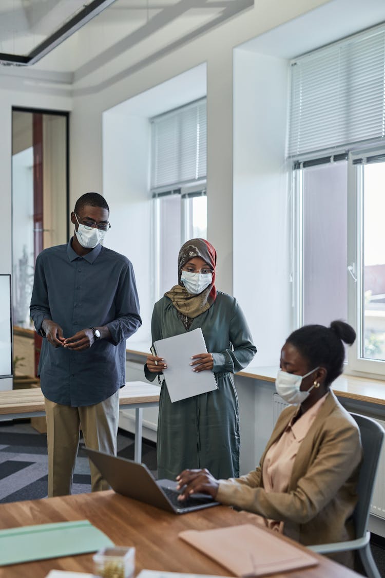 Colleagues At The Office Wearing Face Masks