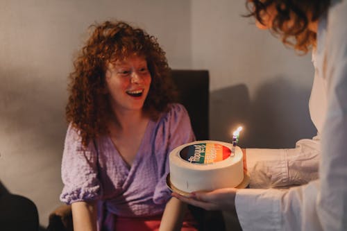 Free A Woman Looking at Her Cake Stock Photo