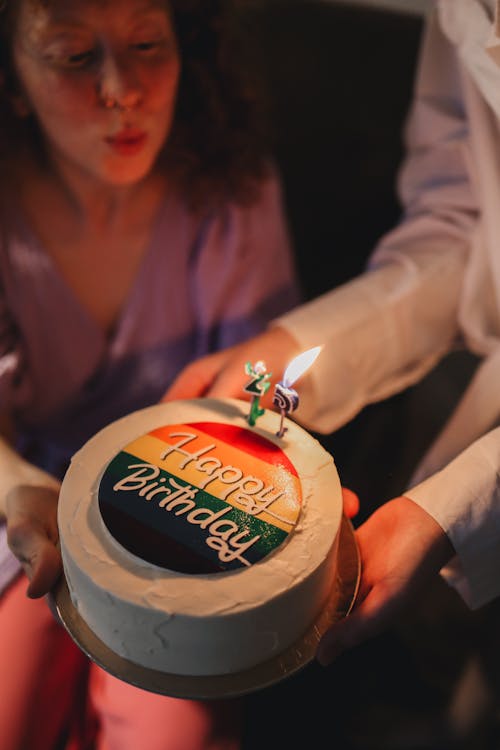 Free A Person Holding a Cake Stock Photo