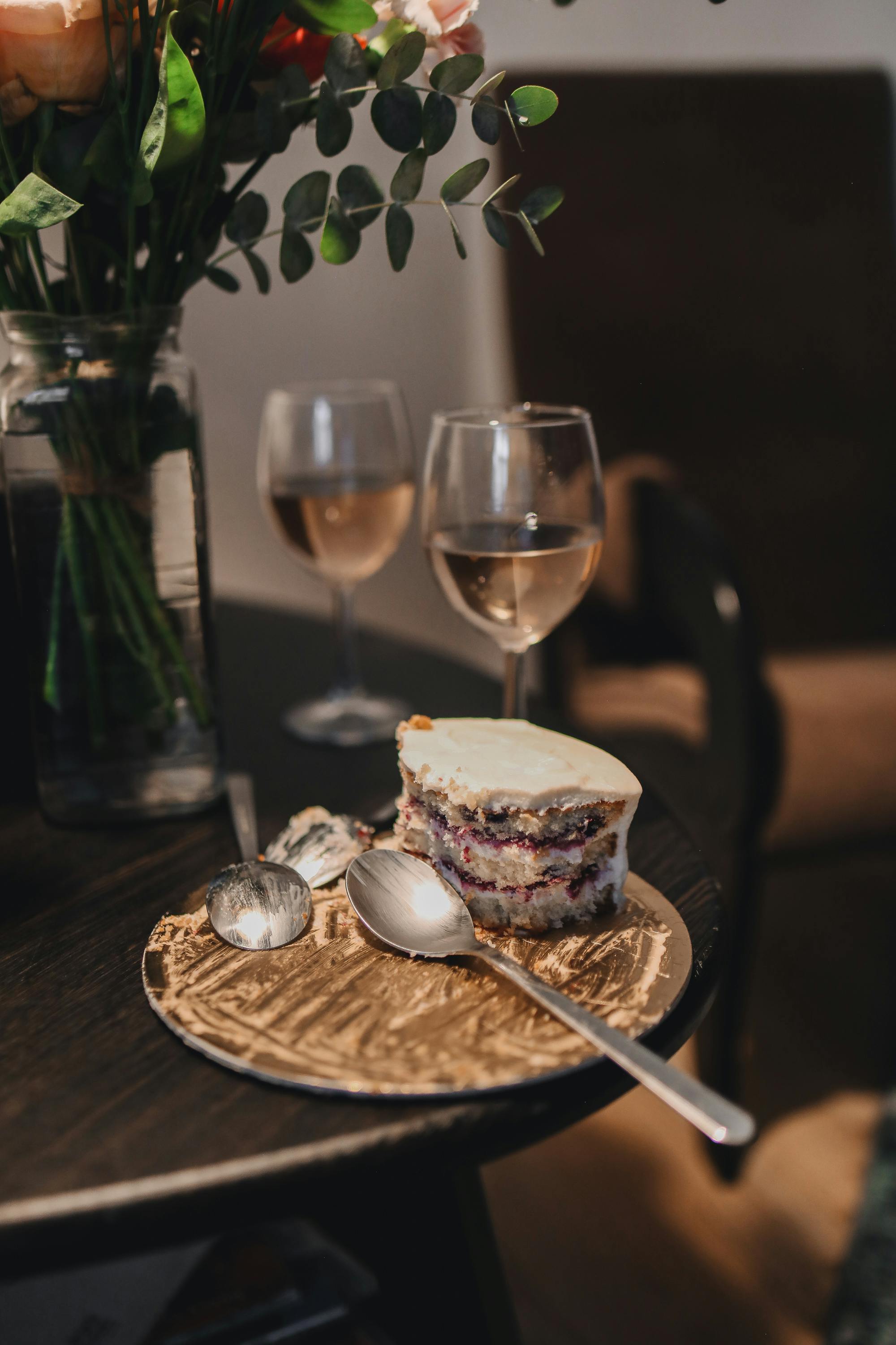 leftover cake and glass of wine on the table