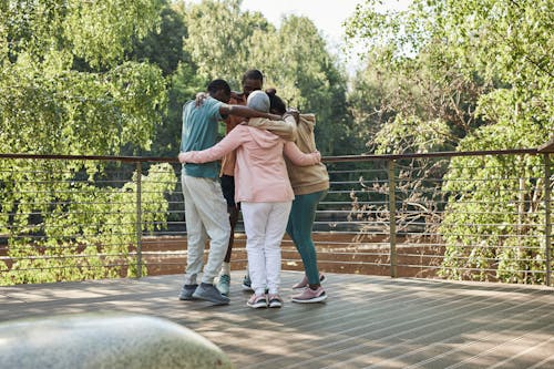 Friends Standing on the Wooden Dock