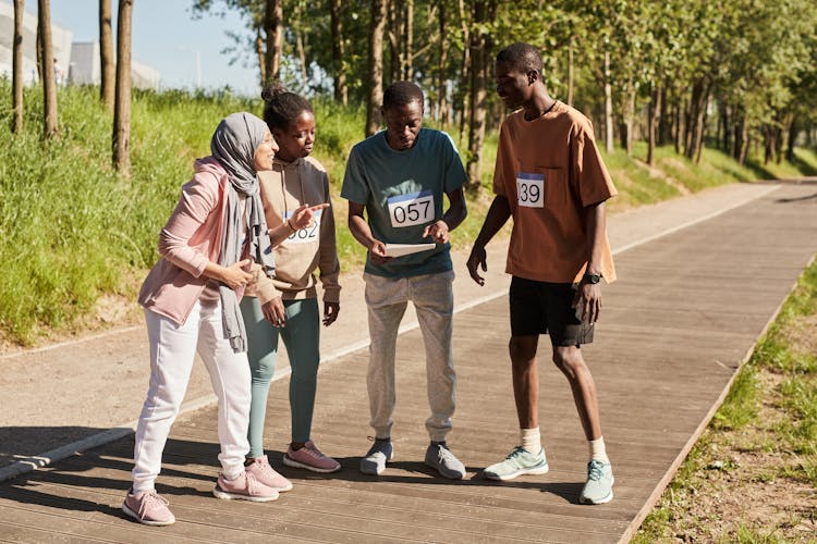 Women And Men In Competition In Park