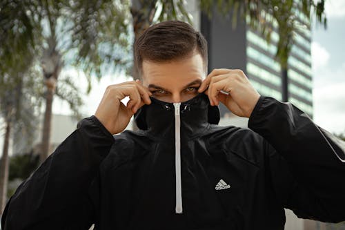 Man Wearing Black Jacket in Close Up Photography