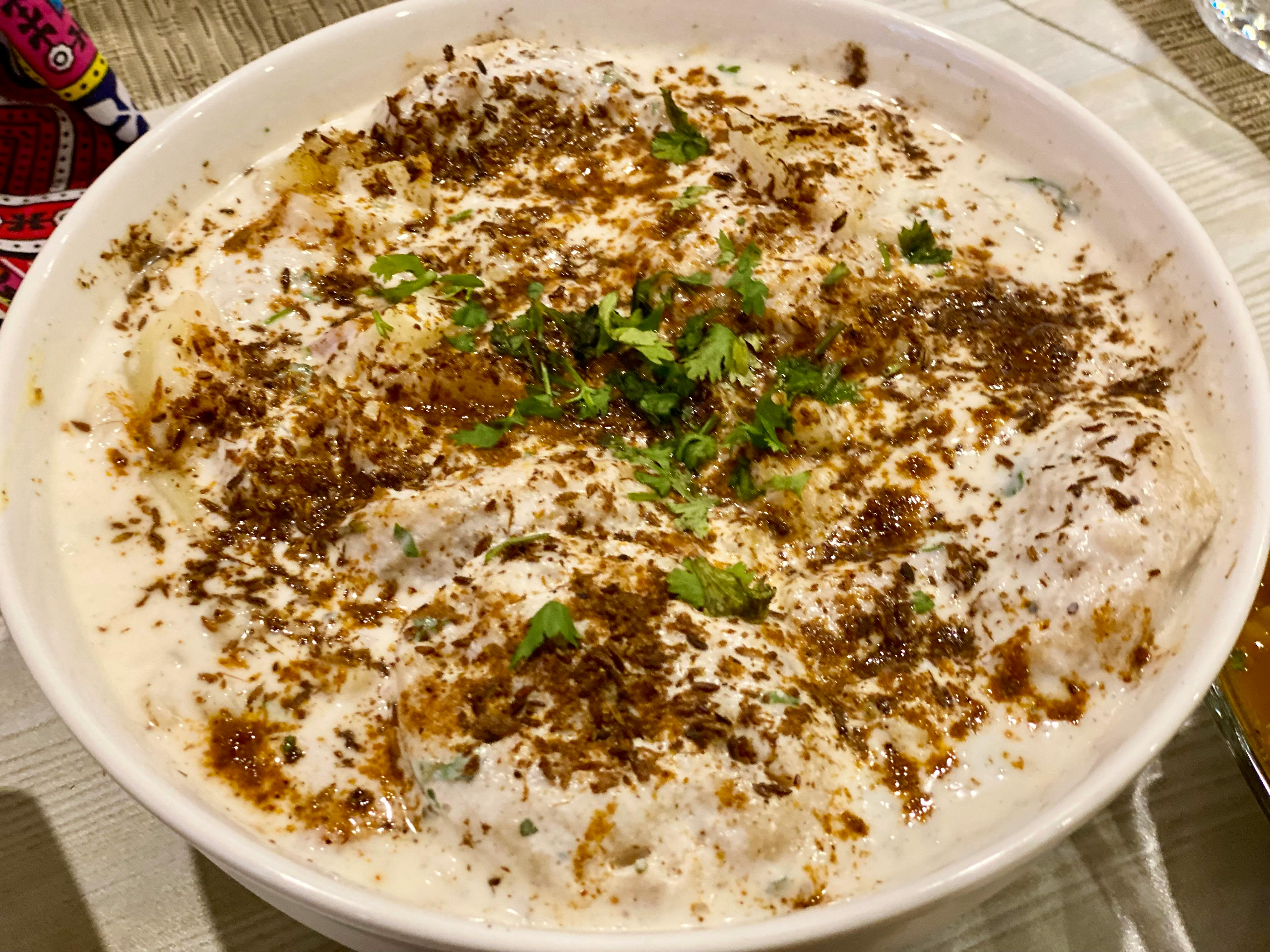 Couple sitting across a small table, appearing to have a serious conversation