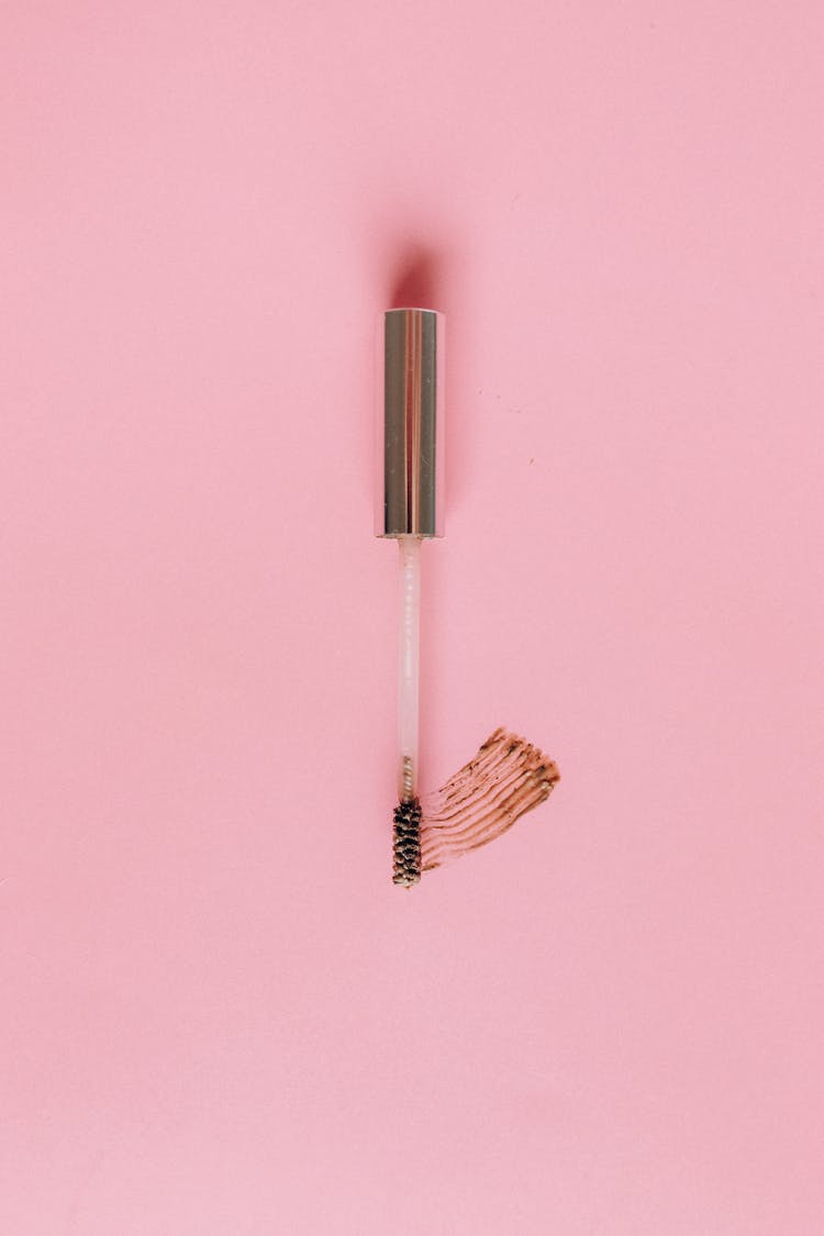 Mascara Brush On A Pink Surface 