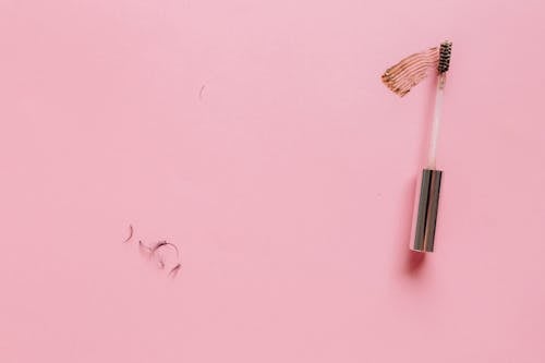 Mascara Brush on a Pink Surface 