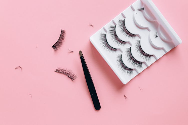 False Eyelashes On Pink Surface