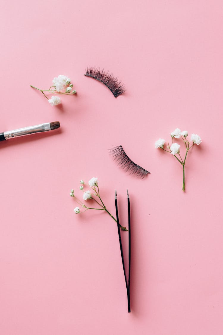 False Eyelashes On Pink Surface