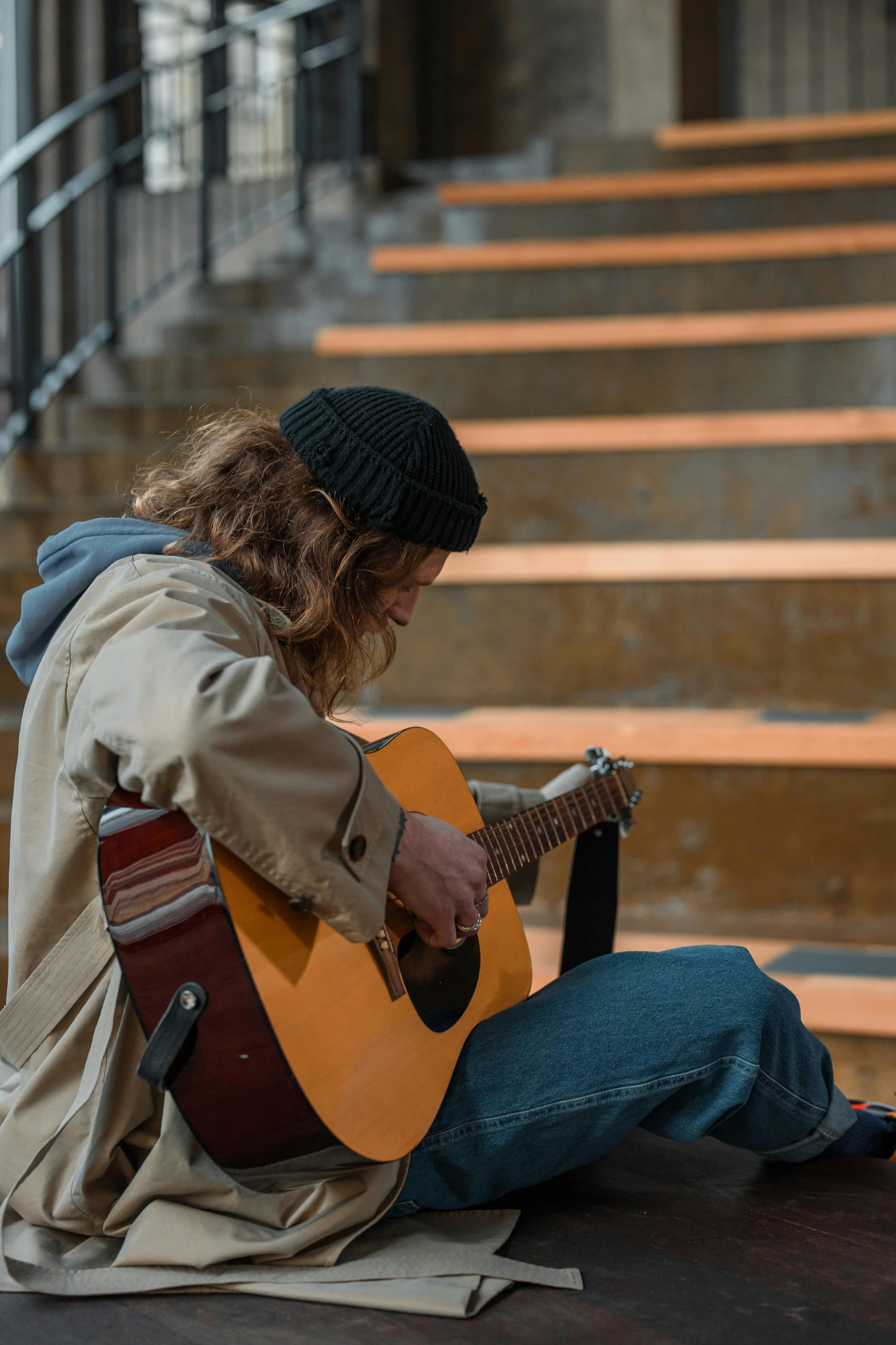 a man playing acoustic guitar