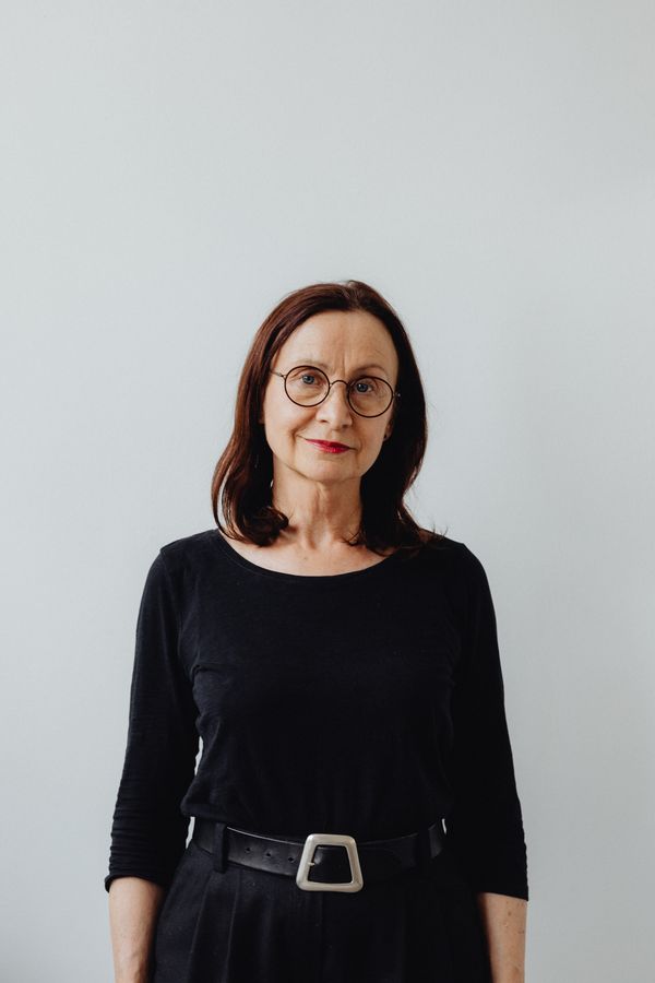 Elegant portrait of a senior woman in black attire