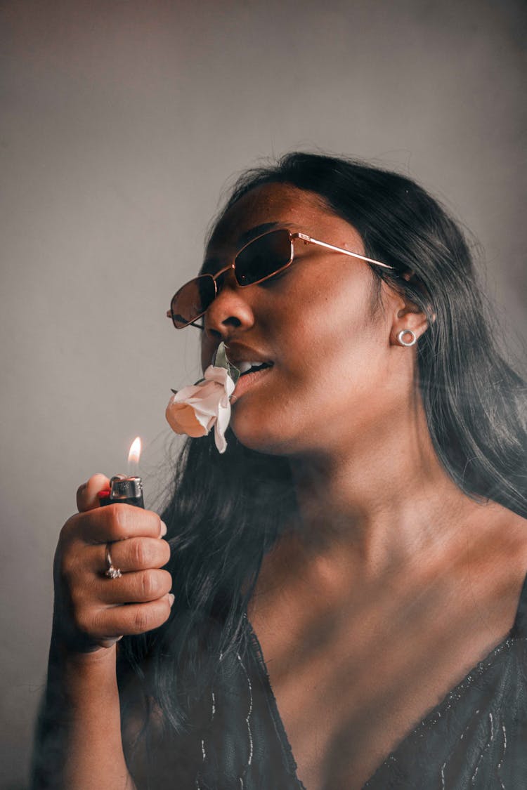 A Woman Holding A Lighter