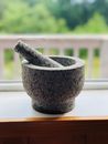 Gray Mortar and Pestle on a Surface