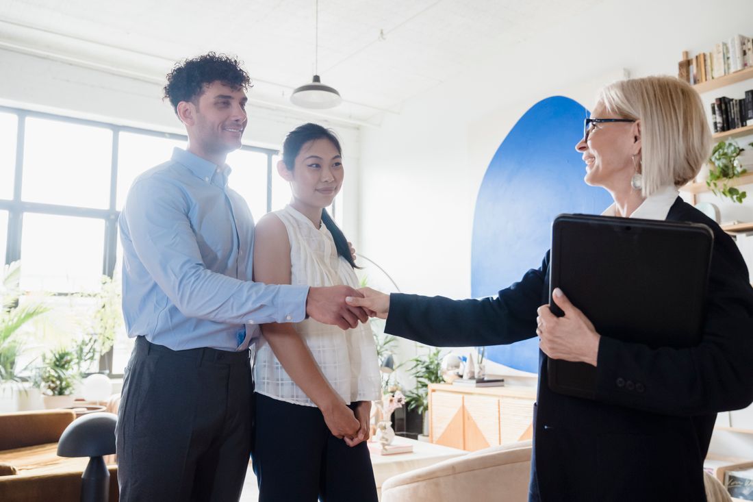 Immigration consultants welcoming clients during a contact meeting