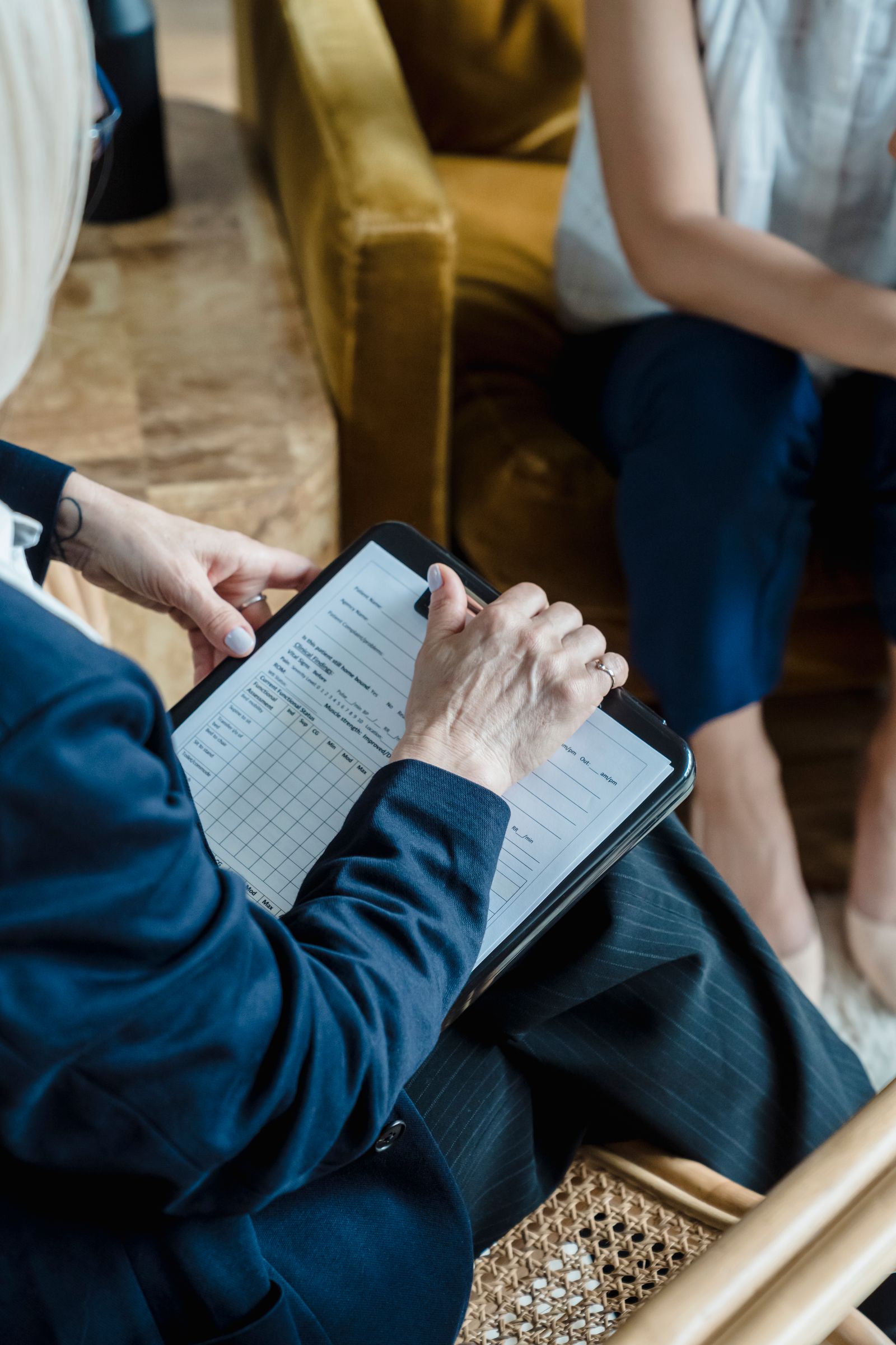 Professional holding a clipboard during a planning discussion