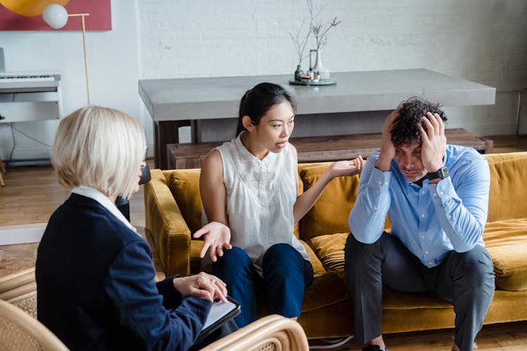 Couple On A Couch On Therapy Session