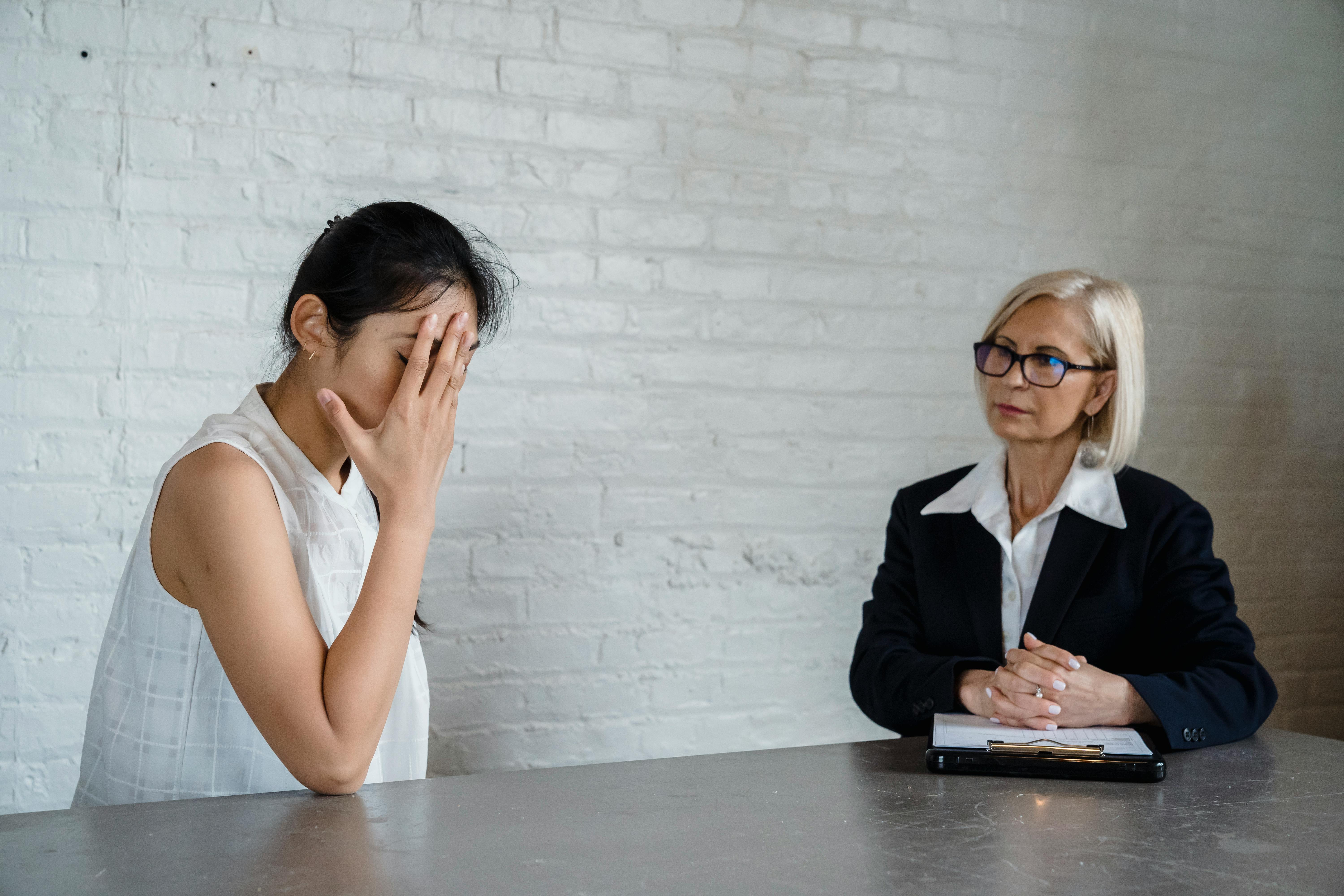 emotional woman with hand on face