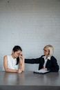 Blonde Woman Comforting the Stressed Person