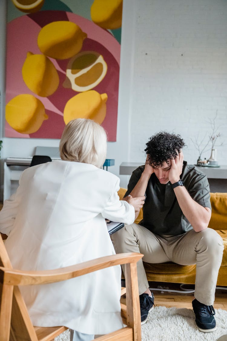 Young Man And A Therapist Talking 