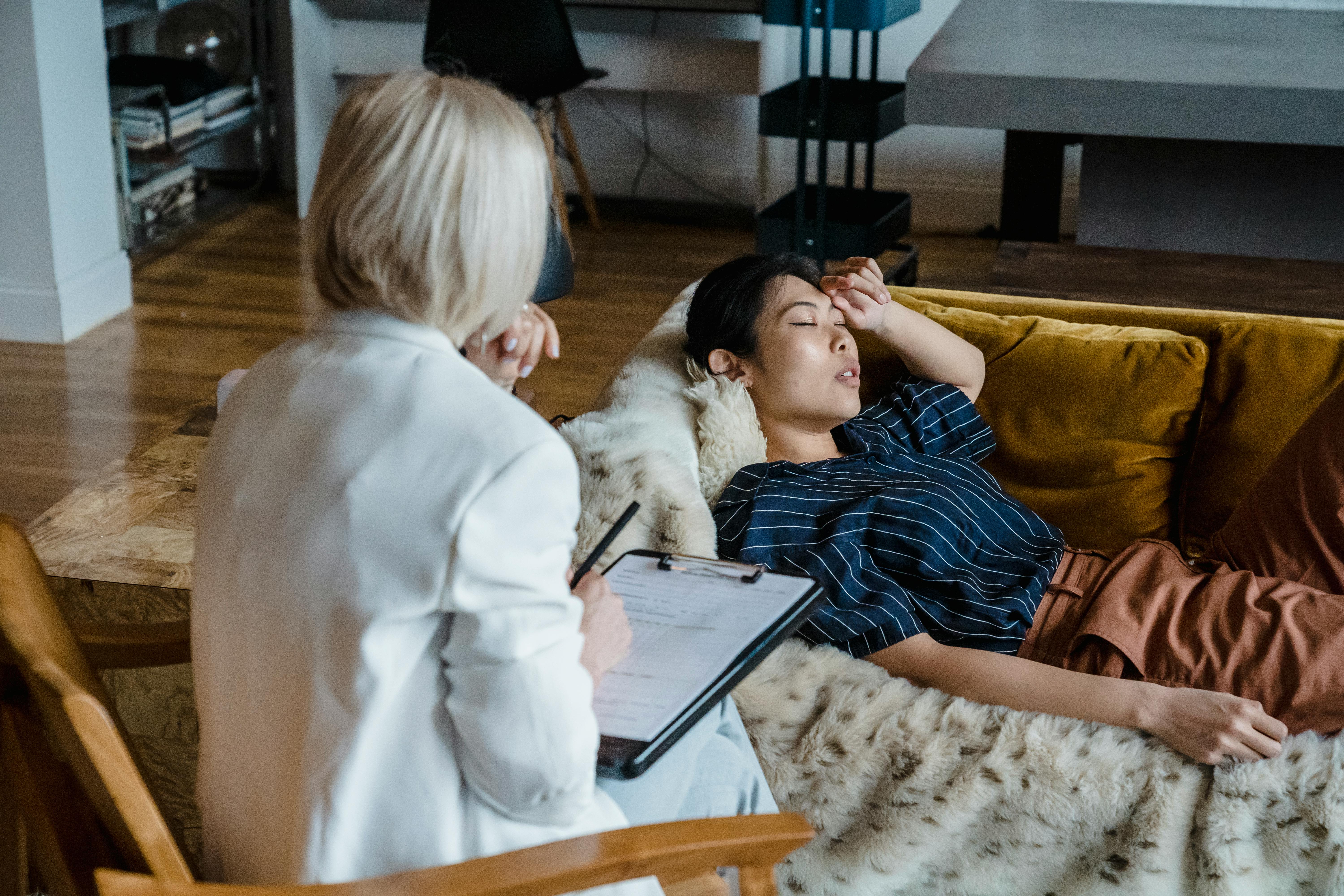 Young Woman Lying on the Couch at a Therapy Session