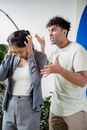 A Man Screaming on His Partner